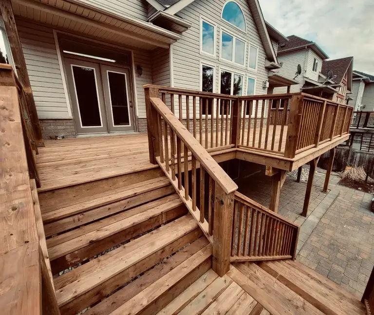 Composite deck with glass railings