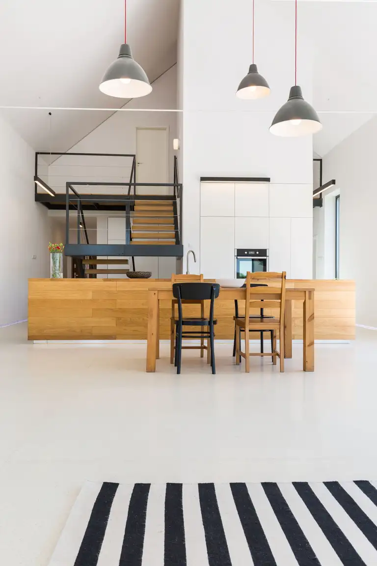 Open concept living space with exposed beam