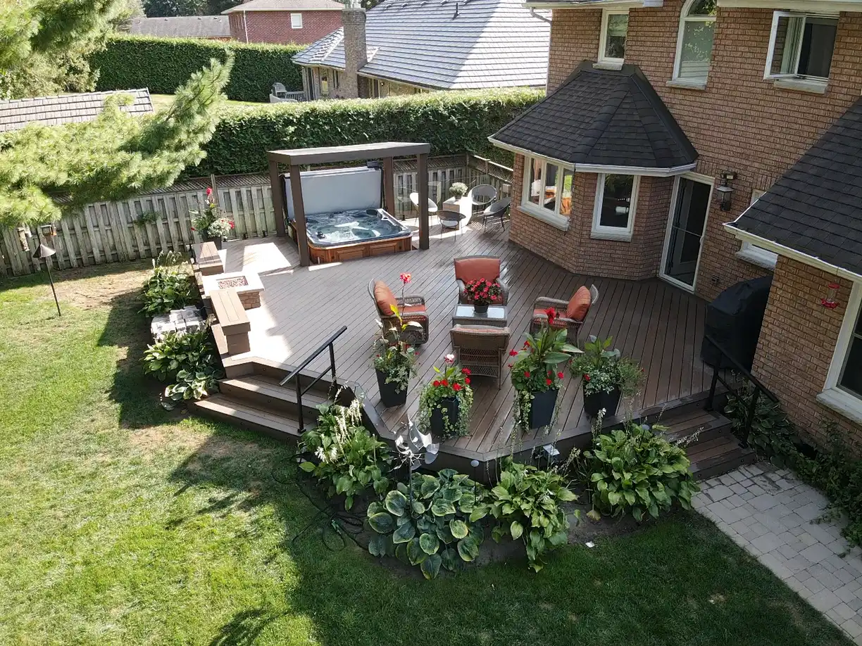Composite deck with glass railing built by Custom Home Works